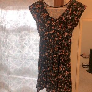 Small cap-sleeved floral dress. Never worn. With tags. Full skirt.